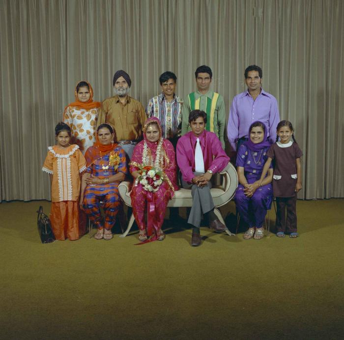 [Photo of Jaginder Singh Gill and Amarjit Gill with wedding guests]