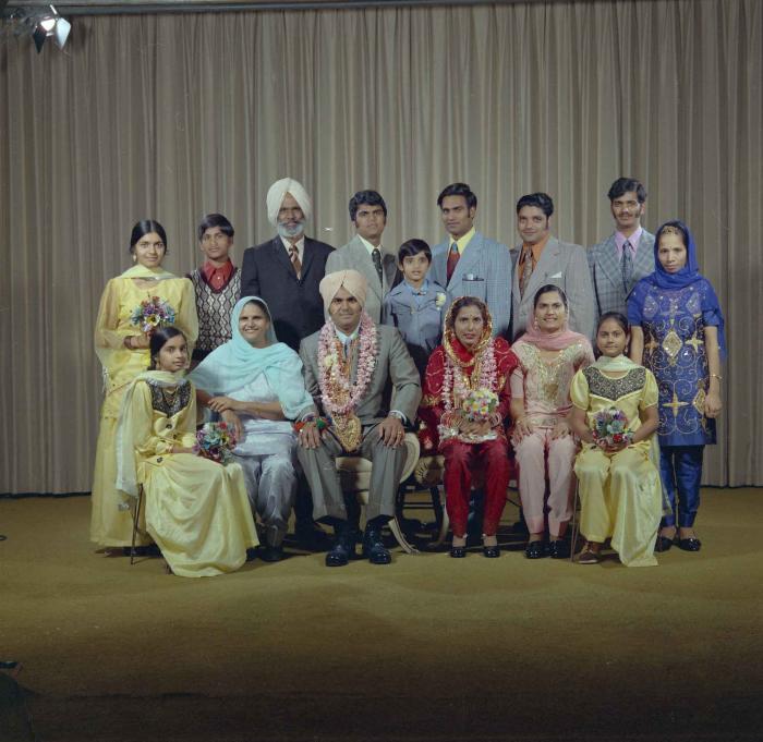 [Photo of Jagiar Singh Kingra along with an unidentified bride and wedding guests]