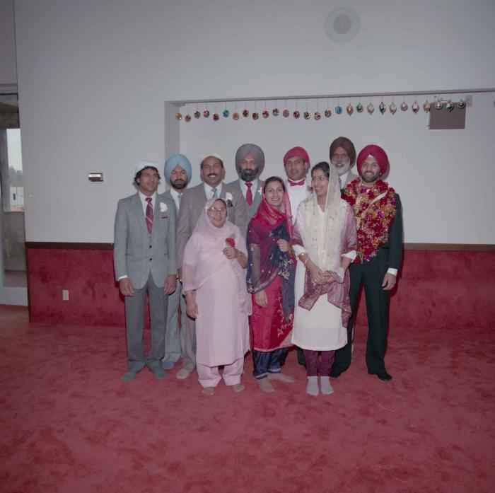 [Group photo of Charan Kaila with family members]