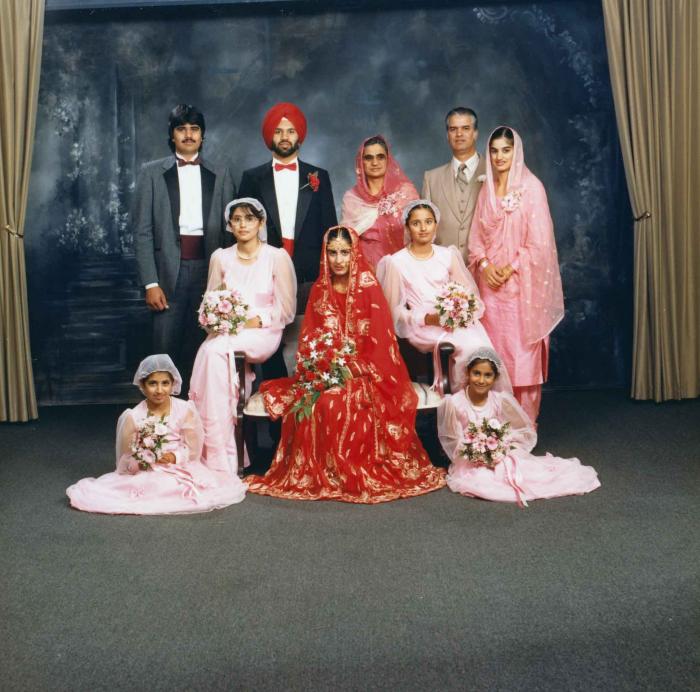[Family photo of Karmajit Gill and Charan Kaila]