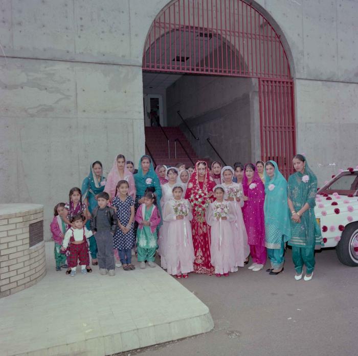 [Photo of Karmjit Gill with unidentified women]