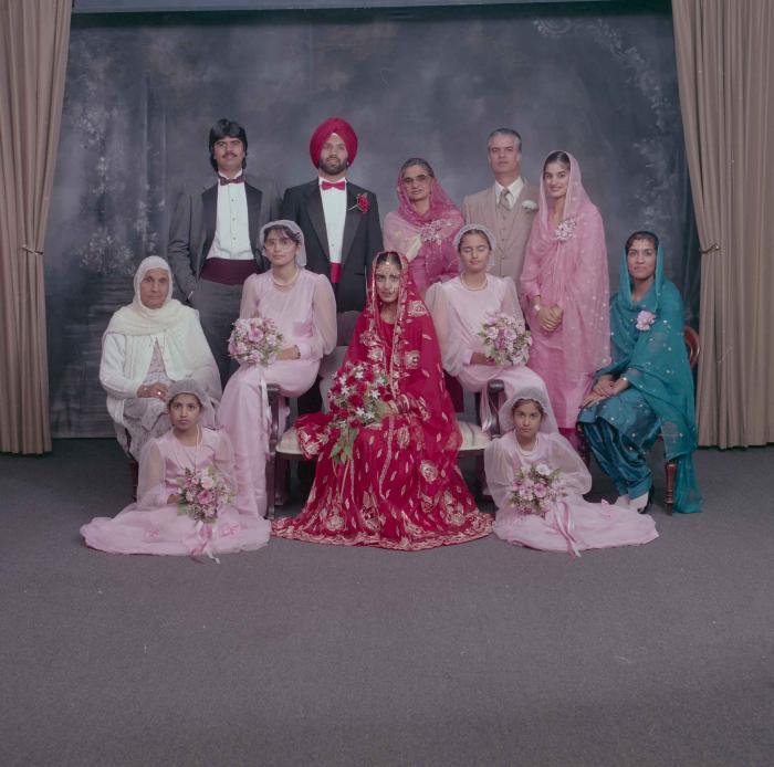 [Photo Charan Kaila and Karmjit Gill with their family members]