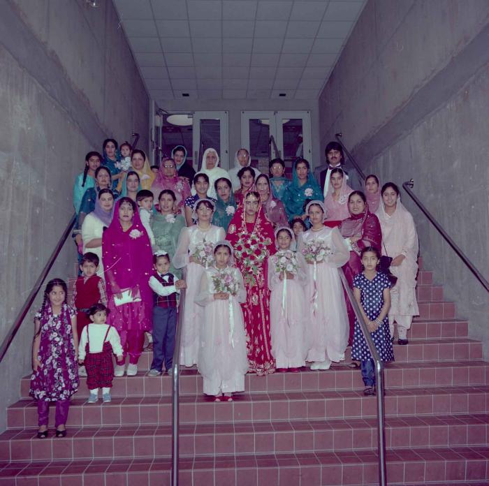 [Photo of Karmjit Gill with unidentified women]