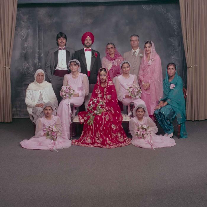 [Photo Charan Kaila and Karmjit Gill with their family members]