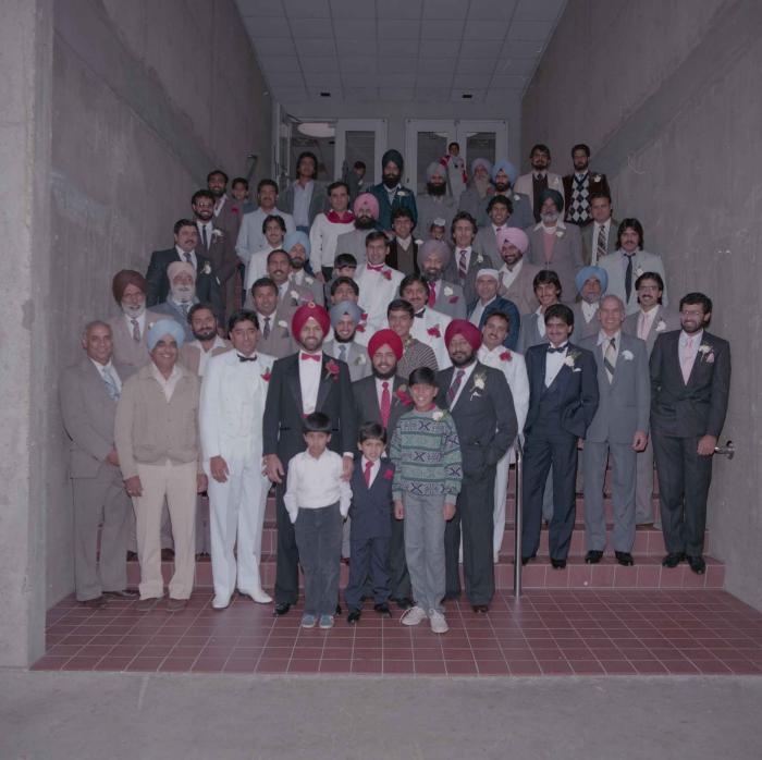 [Photo of Charan Kaila and unidentified men]