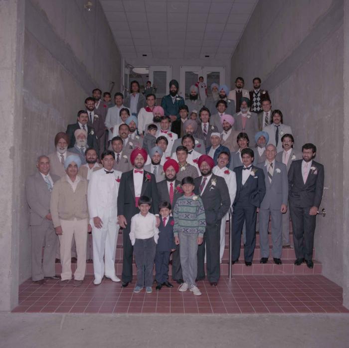 [Photo of Charan Kaila and unidentified men]