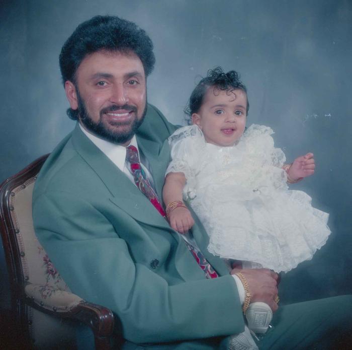 [Photo of Kambo's husband and baby]