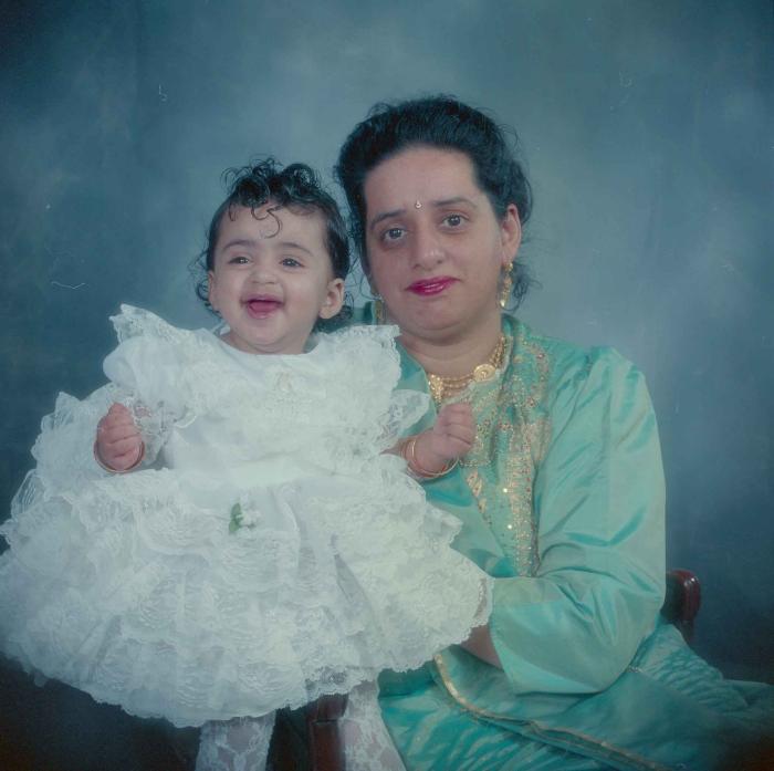 [Photo of an unidentified woman with baby]