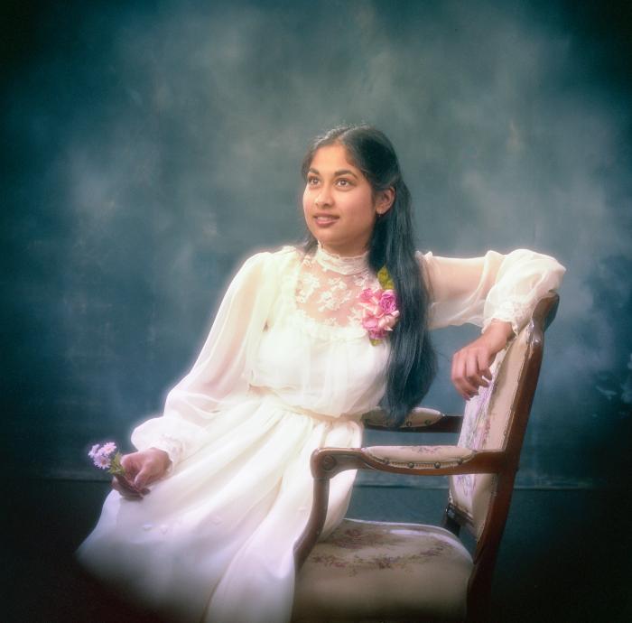 [Portrait of Kel Alamwala sitting on a chair]