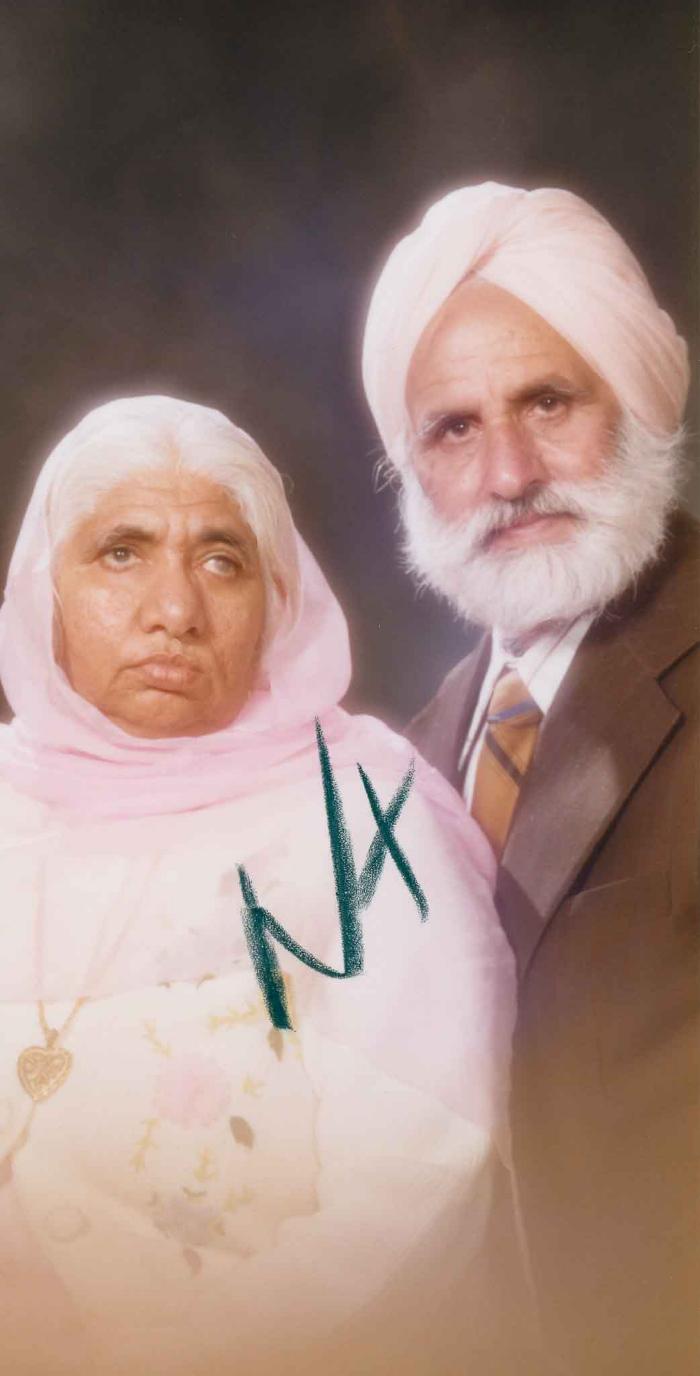 [Photo of an unidentified older couple]