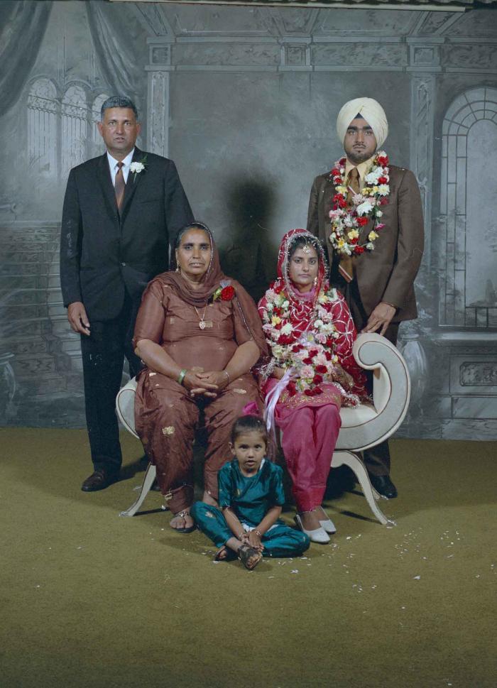 [Photo of Kartar Singh with wedding guests]