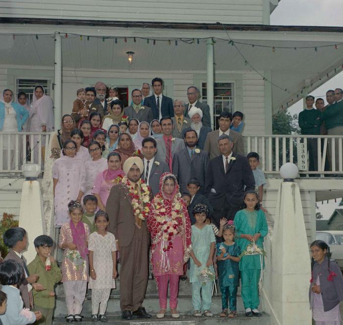[Photo of Kartar Singh with an unidentified bride and wedding guests]