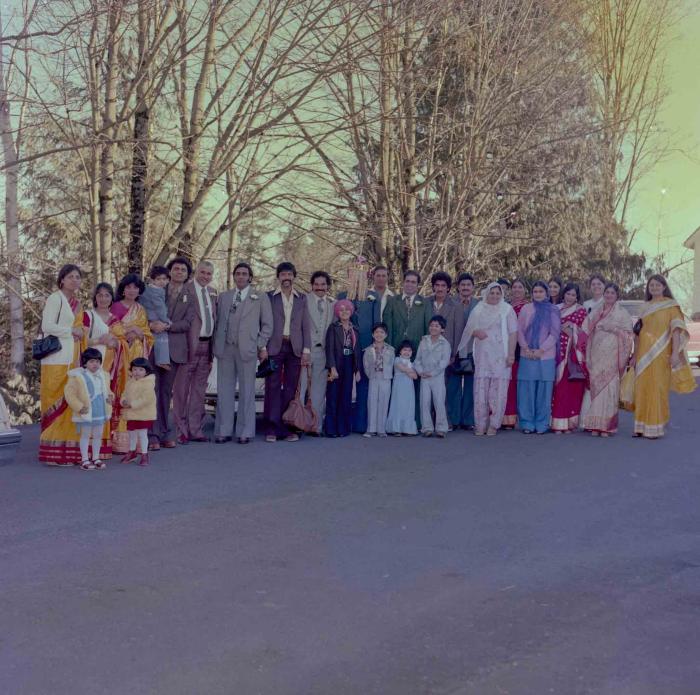 [Group photo of Sukhjinder Khehra with unidentified people]