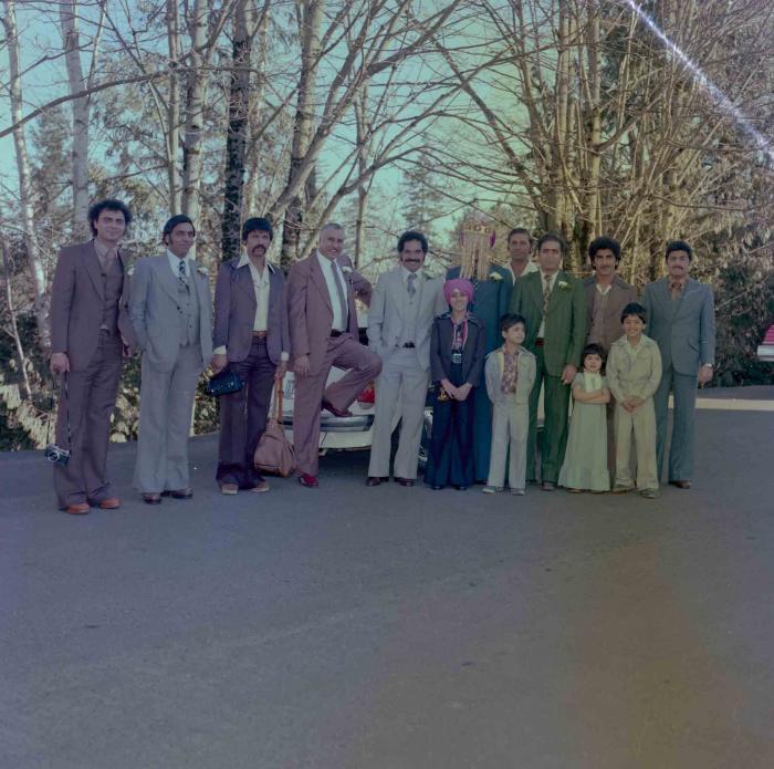 [Group photo of Sukhjinder Khehra with unidentified people]