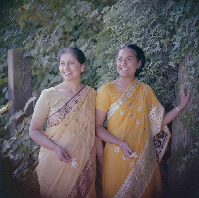 [Photo of Surjit Kingra with an unidentified woman]