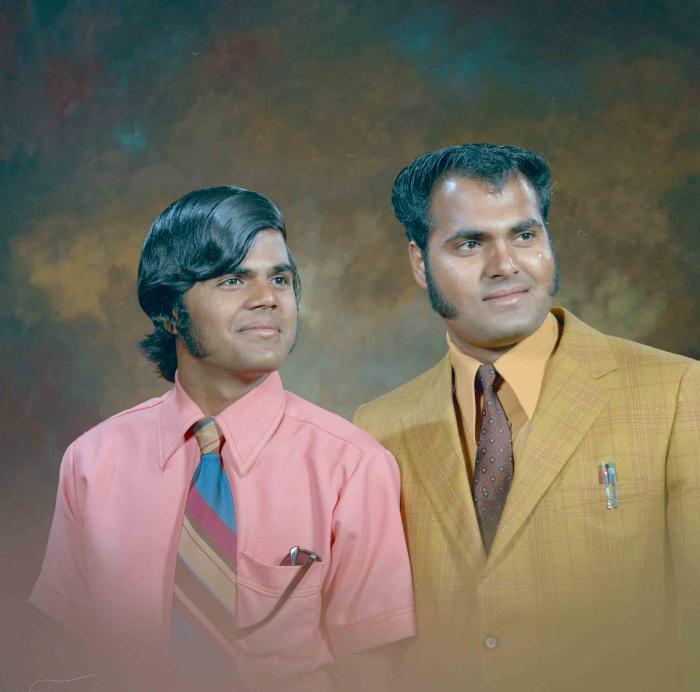 [Photo of two unidentified men]
