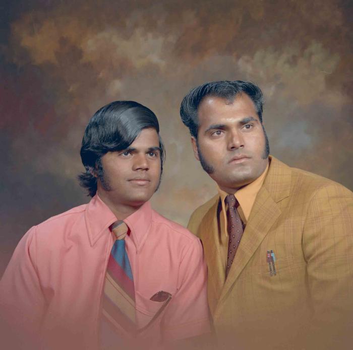 [Photo of two unidentified men]