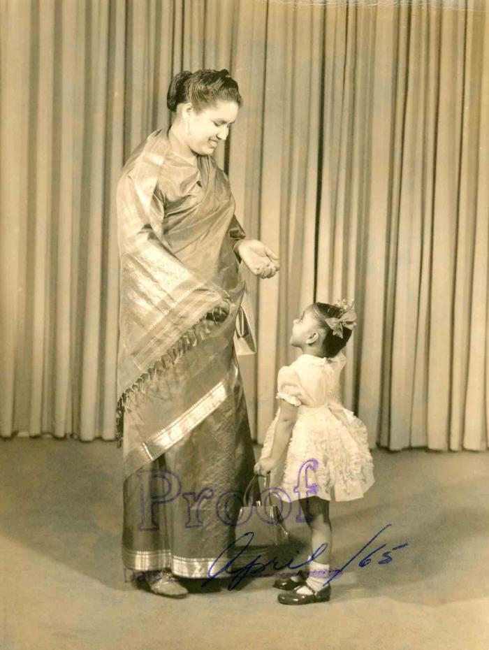 [Photo of Sarjit Kaur with a young child]