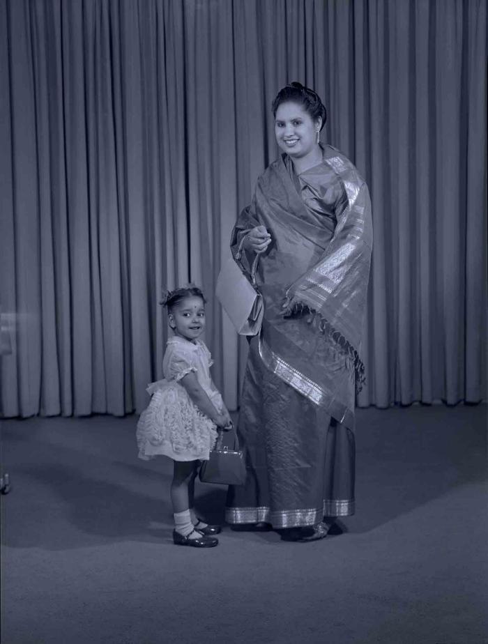 [Photo of Sarjit Kaur with a young child]