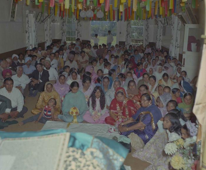 [Group photo of unidentified bride with wedding guests]