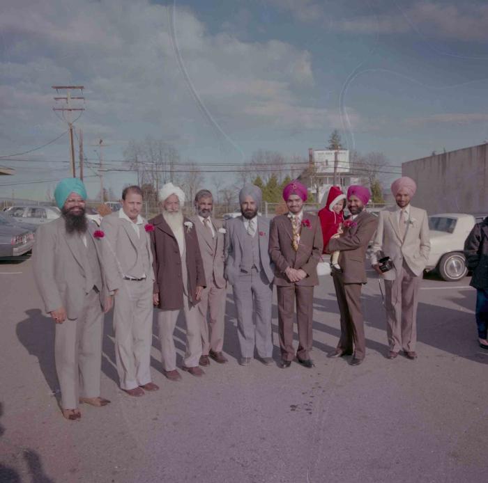 [Photo of Iqbal Mahol with wedding guests]