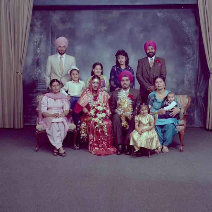 [Photo of Iqbal Mahol with wedding guests]