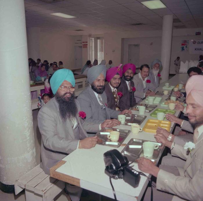 [Photo of Iqbal Mahol with wedding guests]