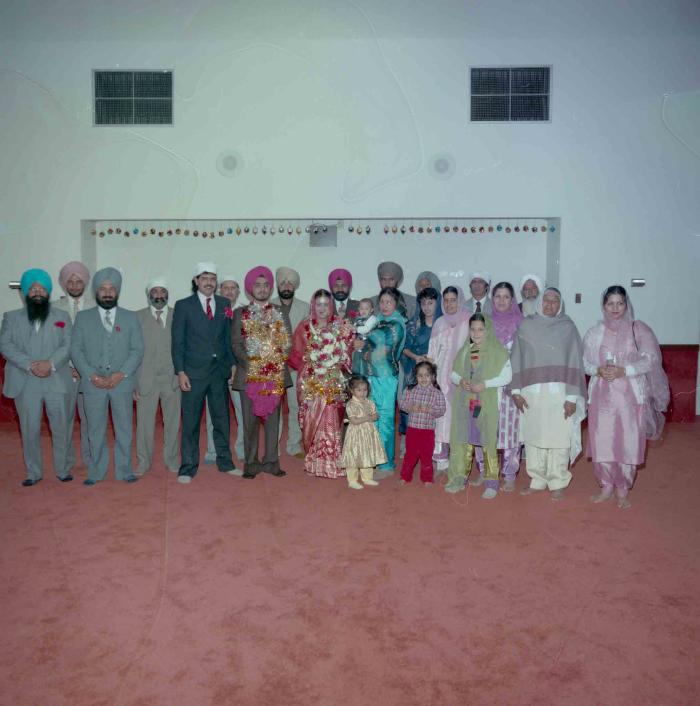 [Photo of Iqbal Mahol and Manjinder Nagra with their wedding guestss]