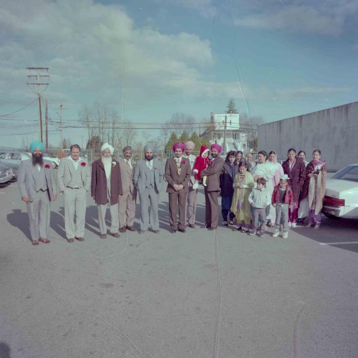 [Photo of Iqbal Mahol with wedding guests]