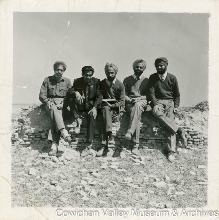 [Five unidentified men posing for a photo]