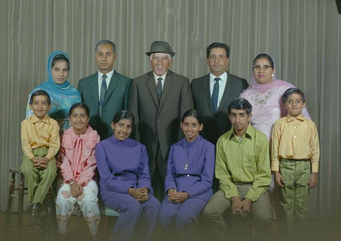 [Group photo of Mukhtiar Singh with family members]
