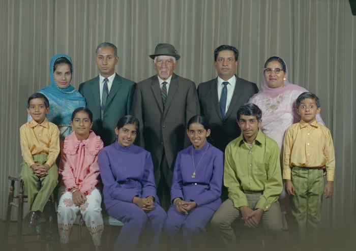 [Group photo of Mukhtiar Singh with family members]