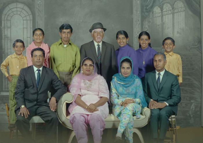 [Group photo of Mukhtiar Singh with family members]