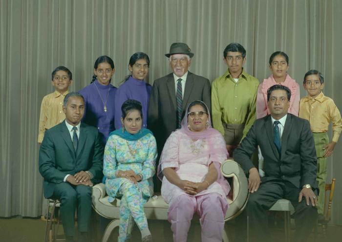 [Group photo of Mukhtiar Singh with family members]