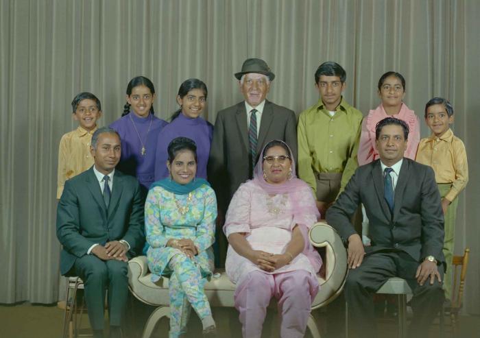 [Group photo of Mukhtiar Singh with family members]