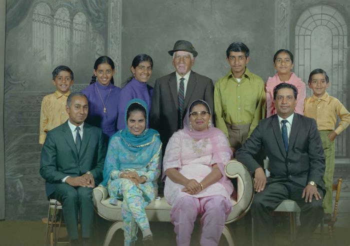 [Group photo of Mukhtiar Singh with family members]