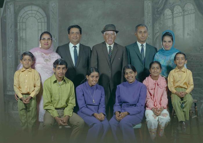 [Group photo of Mukhtiar Singh with family members]