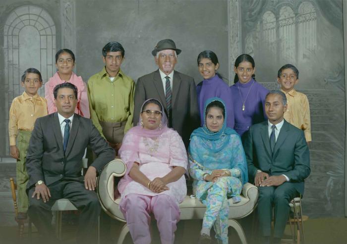 [Group photo of Mukhtiar Singh with family members]