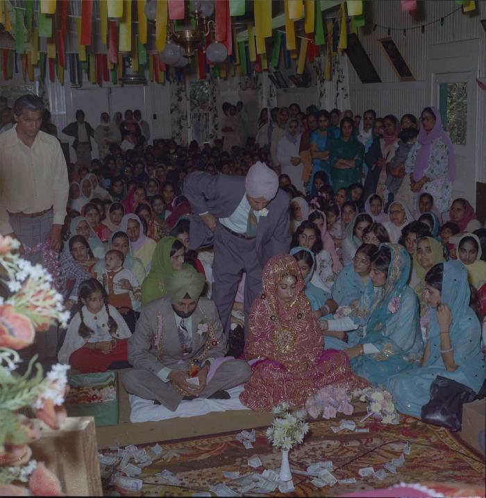 [Photo of Onkar Brar and Malkit Gill]