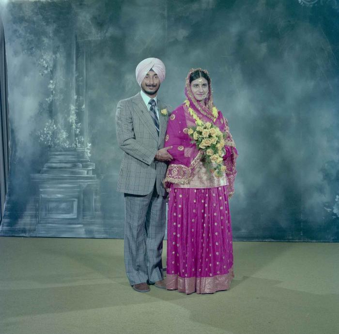 [Photo of Joginder Thind and Parminder Grewal]