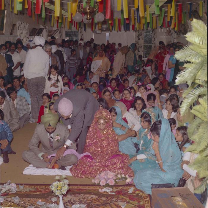 [Photo of Malkit Gill and Onkar Brar]