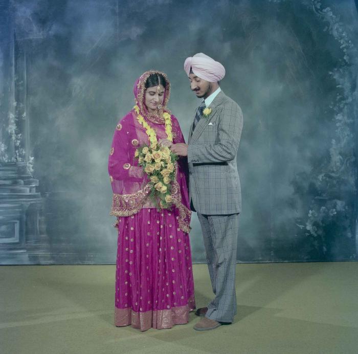 [Photo of Joginder Thind and Parminder Grewal]