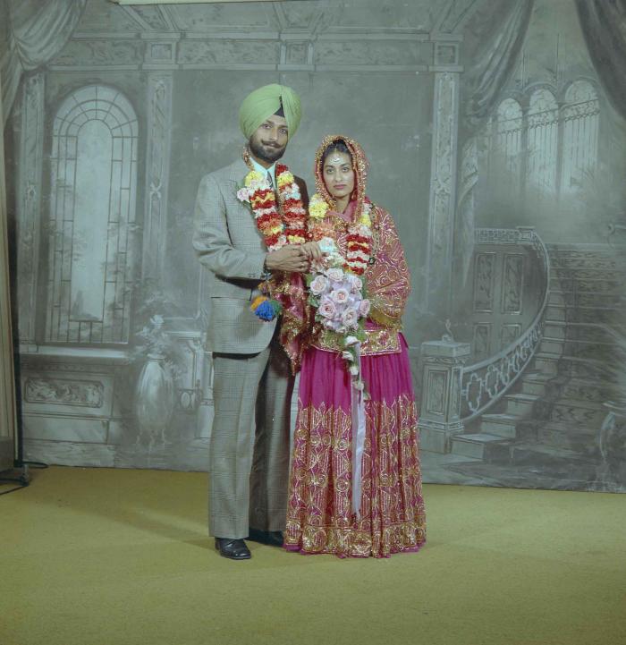 [Photo of Malkit Gill and Onkar Brar]