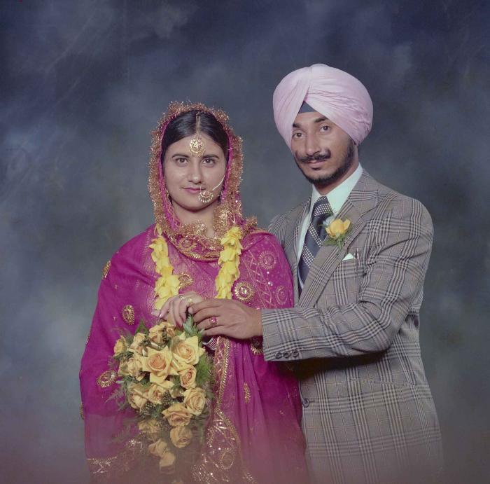 [Photo of Joginder Thind and Parminder Grewal]
