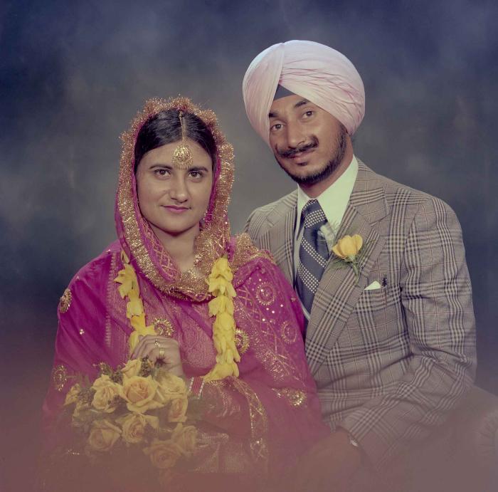 [Photo of Joginder Thind and Parminder Grewal]